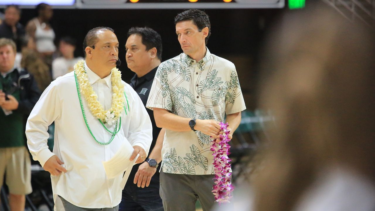 Hawaii Athletic Director Matt Elliott, middle, waited to greet Rainbow Warriors seniors with lei during traditional postgame ceremonies after UH lost to Long Beach State in the 2025-26 home finale Saturday.