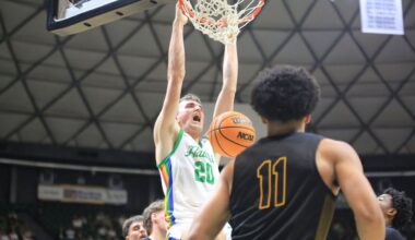 Hawaii center Isaac "Big Fish" Johnson dunked the ball against Long Beach State on senior night Saturday. Beach guard Gavin Sykes (11) was named Big West Freshman of the Year after leading LBSU to a spoiler win over UH.