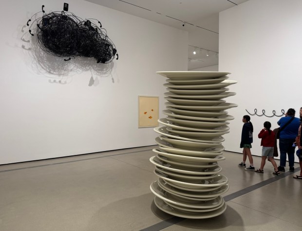 A stack of oversized ceramic plates and a dark cloud composed of tangled phone cords are among the sly artworks by Robert Therrien at The Broad. (Photo by David Allen, Inland Valley Daily Bulletin/SCNG)