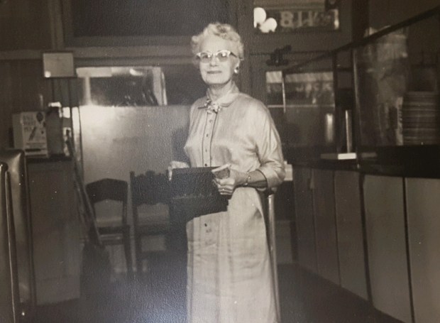 Inez Garlinghouse is seen, probably in the early 1950s, near the entry of Cole's P.E. Buffet, where she was hostess. She was also the wife of chef Jack Garlinghouse. (Courtesy Tim Peron)