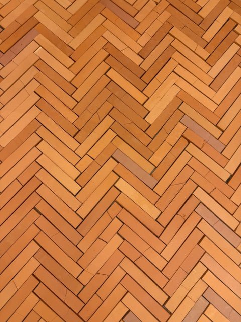 Cracked handmade ceramic tile floor in Cammie Staros Pompeii exhibition