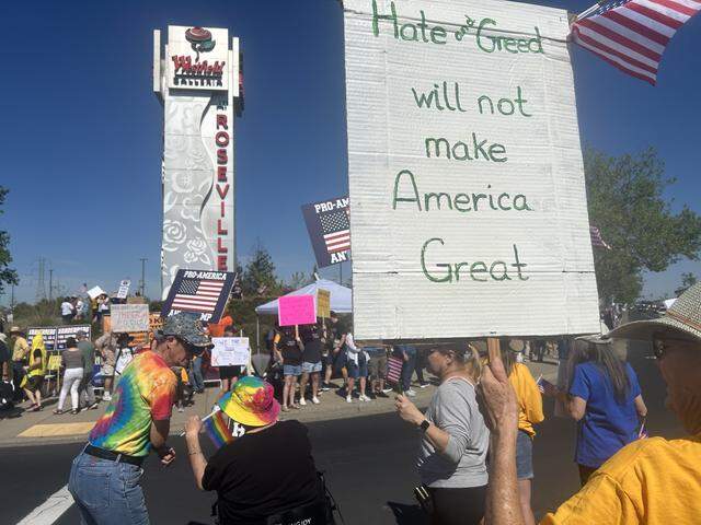 Hundreds of demonstrators rally Saturday morning at the Westfield Galleria mall in Roseville during a “No Kings” protest against the Trump administration.