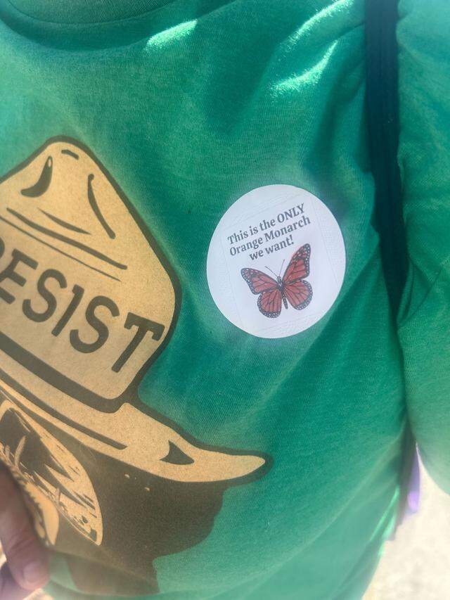 A sticker made by 11-year-old Kennedy Crosby reads “This is the only Orange Monarch we want” as seen during a “No Kings” demonstration protesting against the Trump administration on Saturday outside the Westfield Galleria mall in Roseville.