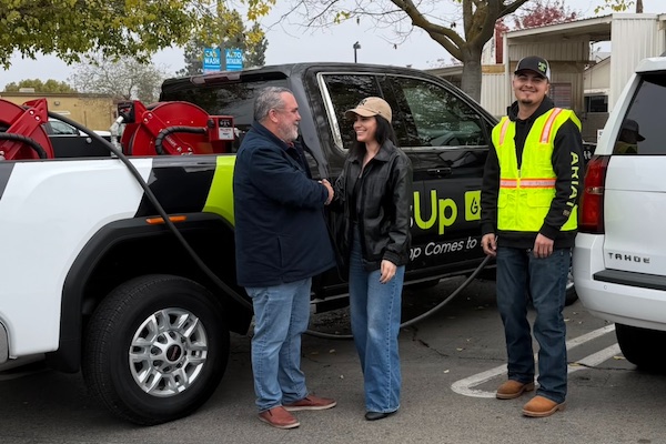fuel truck and three people
