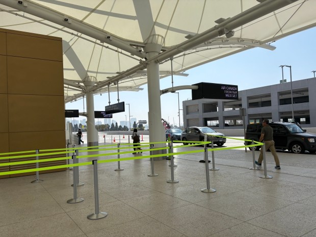 Yellow tape marks security lines at the San Diego International Airport on Tuesday in anticipation of long lines during the partial government shutdown. (Noelle Harff/ The San Diego Union-Tribune)