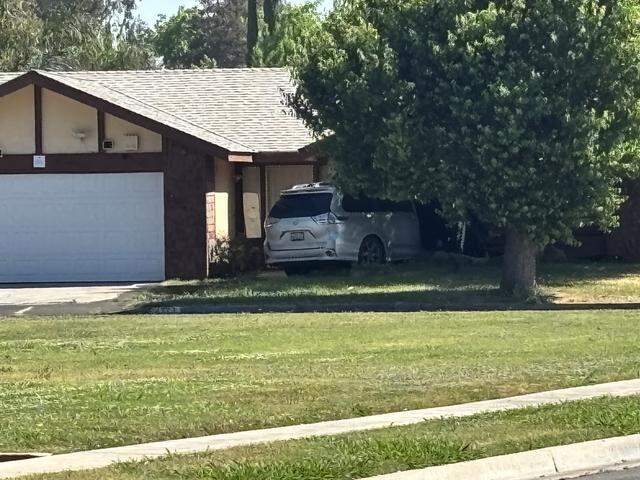 A vehicle plows into a home on Sunday, March 29, 2026 following a disturbance in Fresno, California.