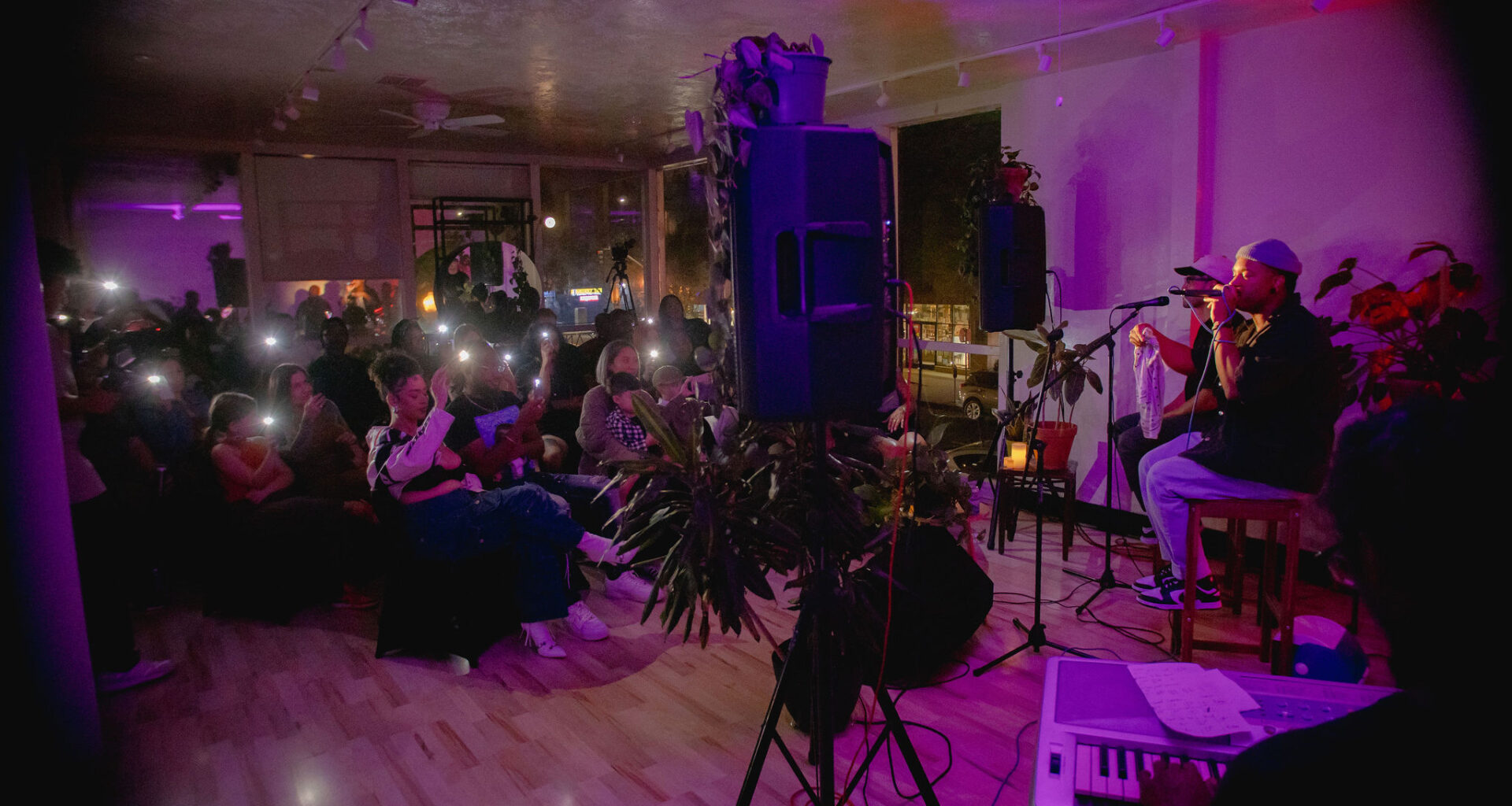 Artists performing for a small audience.