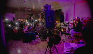 Artists performing for a small audience.