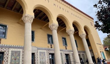 Exterior view of Everett Middle School featuring ornate columns, decorative tile work, and supported by Mission Graduates.