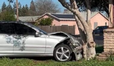 Three-vehicle crash results in car nearly striking apartment