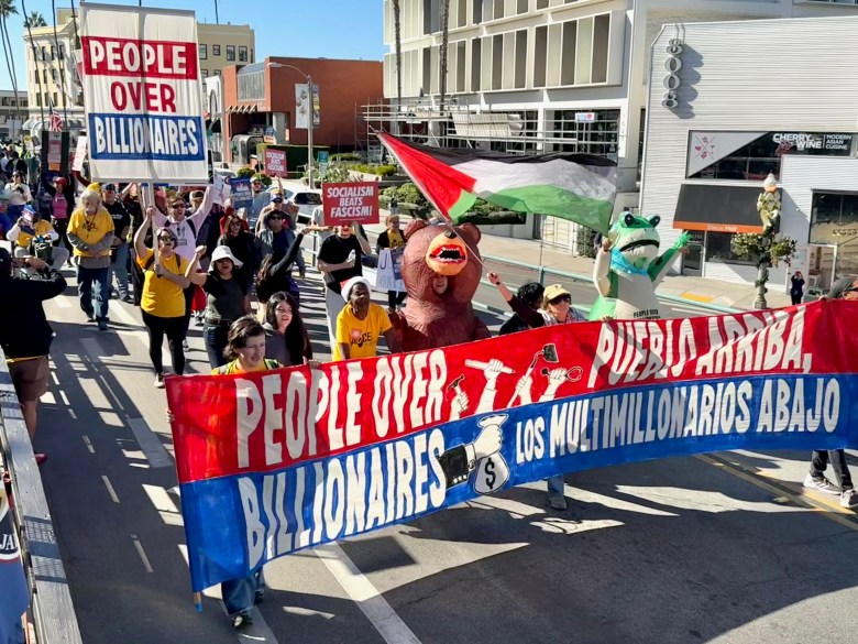 The ‘People over Billionaires’ march on Dec. 6 heads down Prospect Street from Scripps Park. (Photo by Don Balch/Special to La Jolla Village News)
