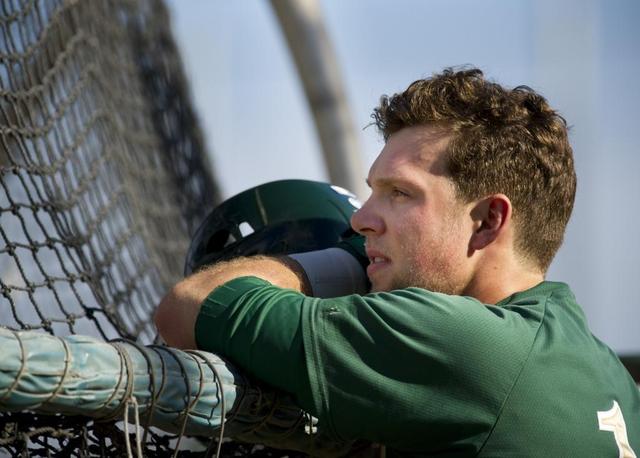Rhys Hoskins, watches a batter from behind the batting cage in practice at Sacramento State, Thursday, Feb. 13, 2014. 