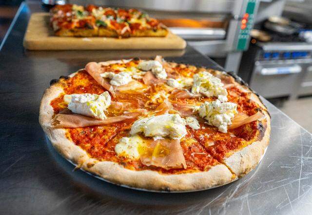 A pizza cools down after being removed from the oven at La Porta Restaurant & Bar on April 16, 2024.