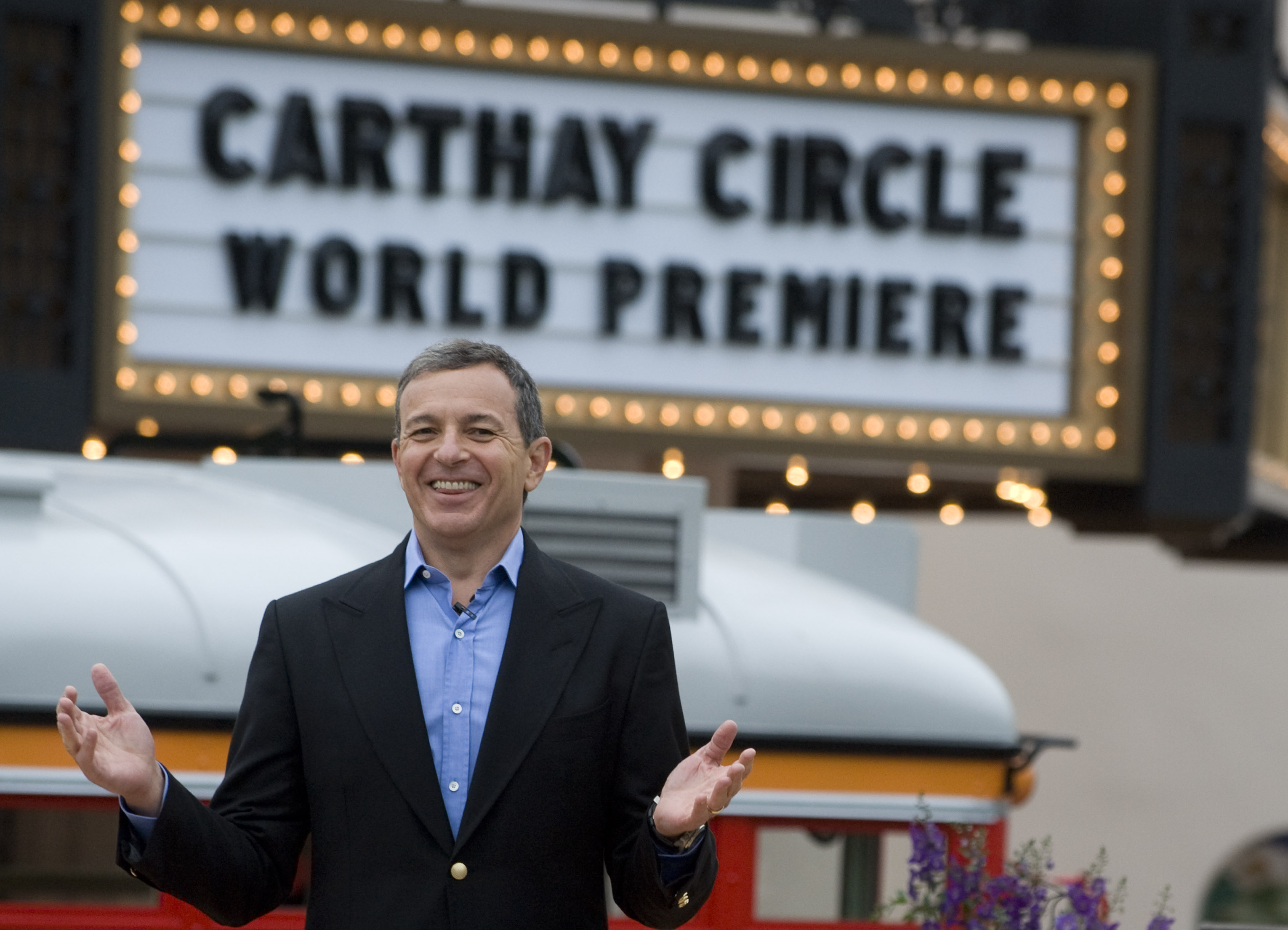 Bob Iger smiles as cheers erupt during rededication ceremony for...