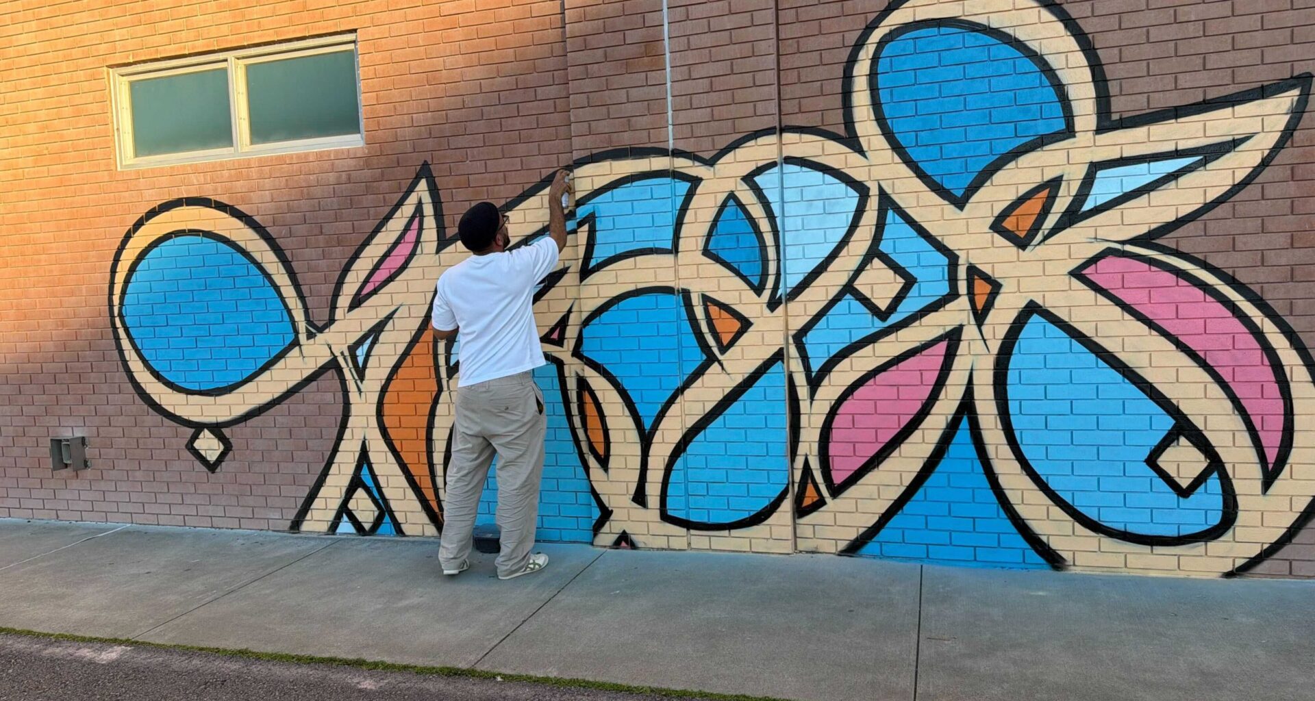 Miles apart, they painted the same mural—in San Quentin & San Francisco