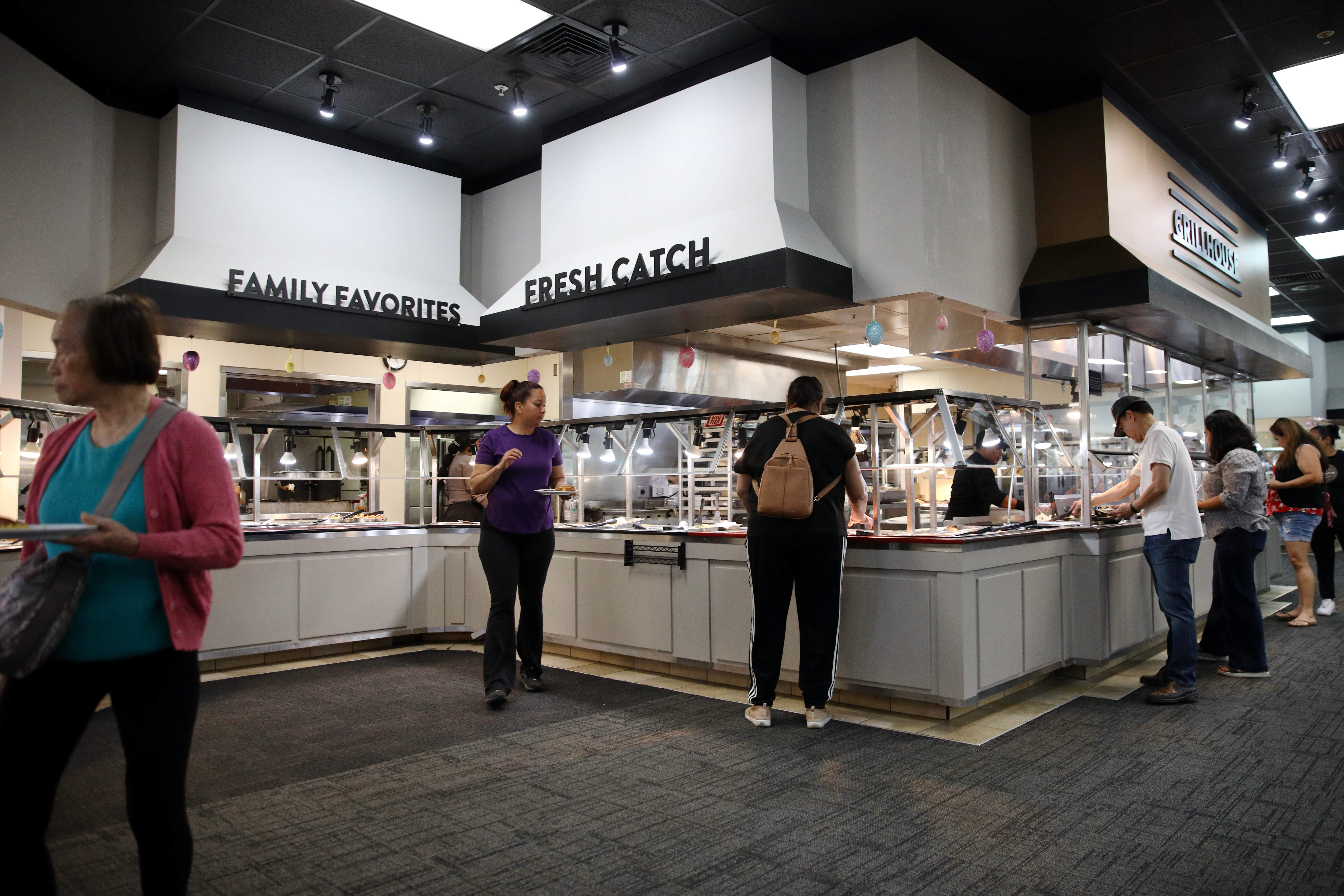 Patrons visit the buffet during lunch hour at Golden Corralâs...