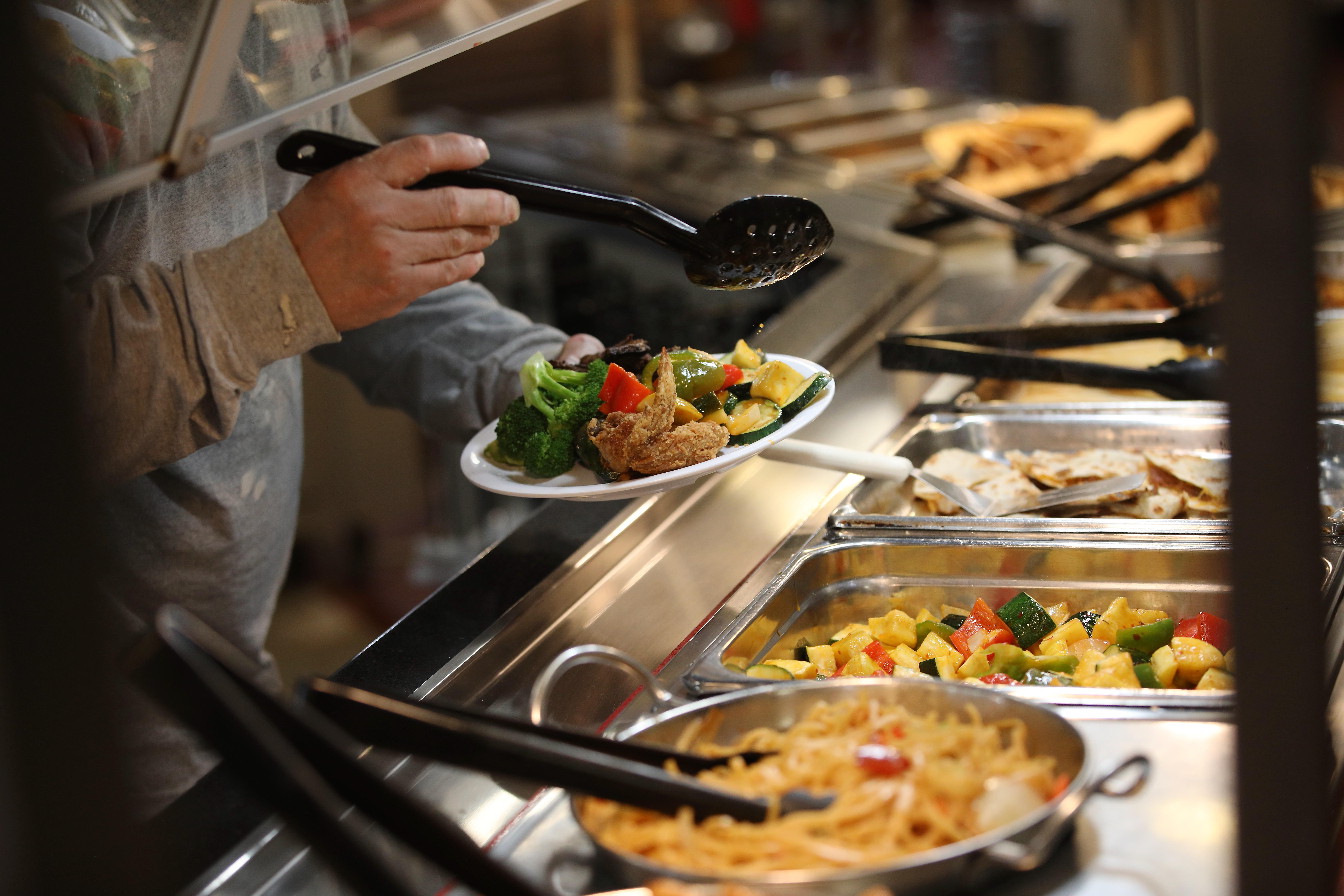 A diner visits the buffet at Golden Corralâs City of...