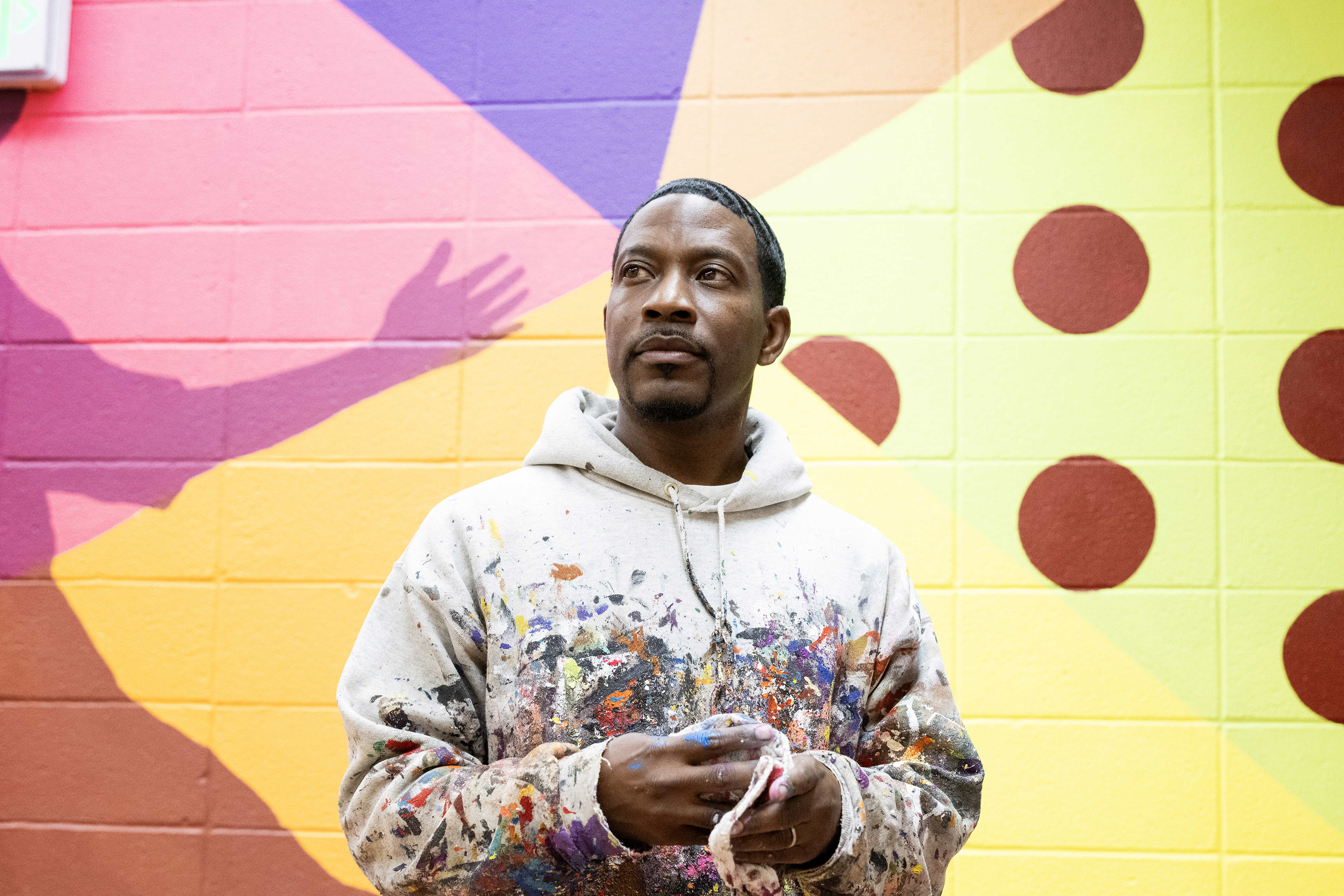 Muralist Mike Norice poses for a portrait at Audubon Middle...