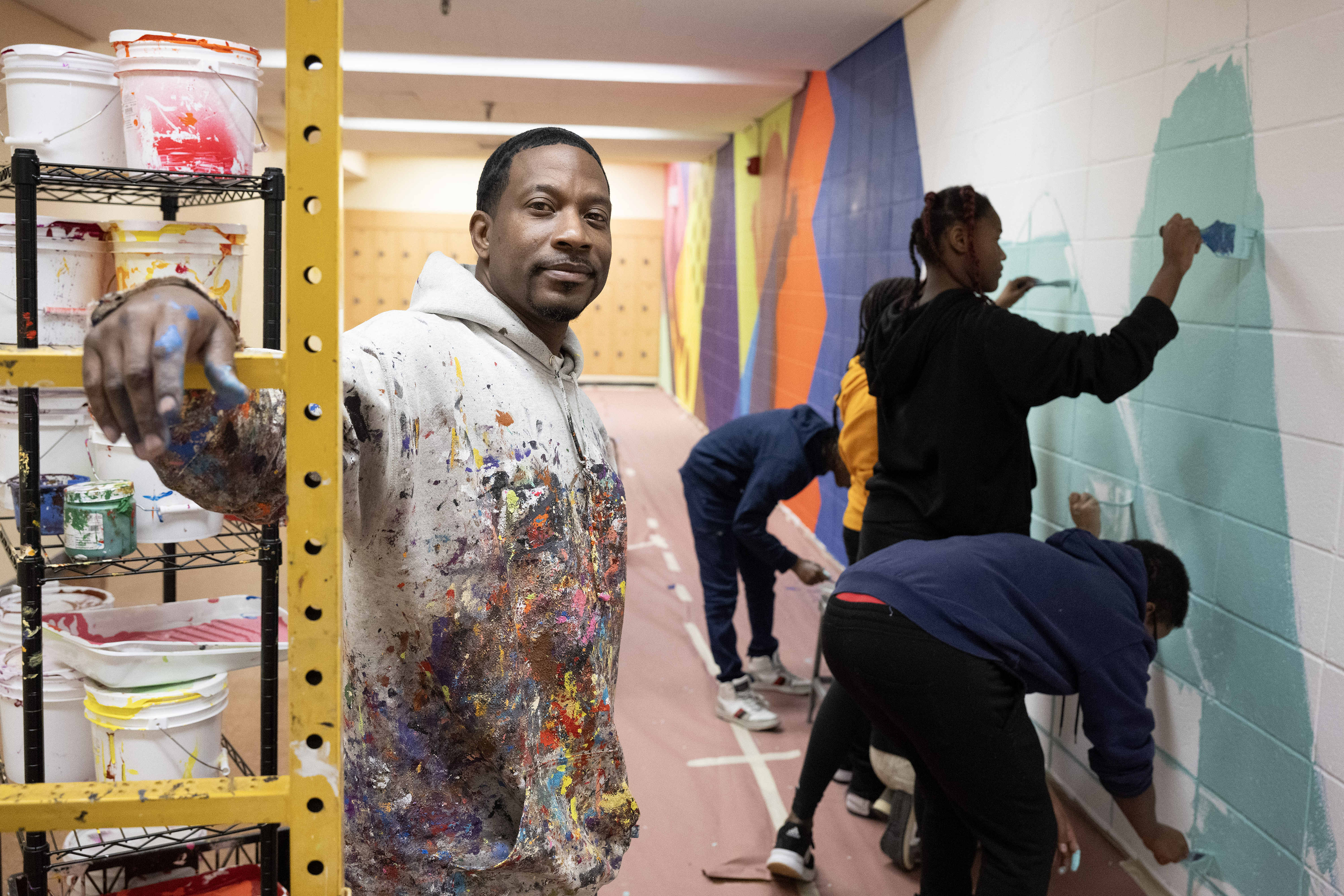 Muralist Mike Norice poses for a portrait at Audubon Middle...