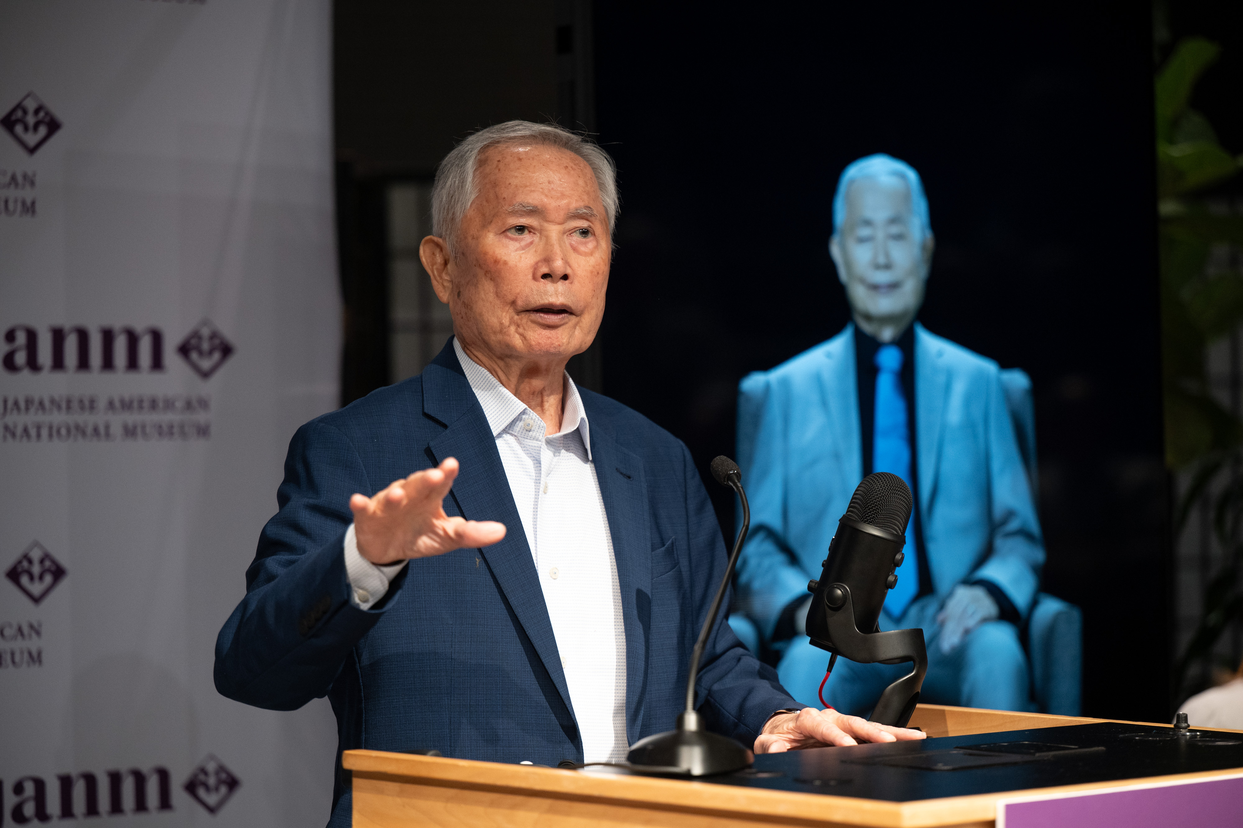 Actor George Takei with an AI image of himself at...