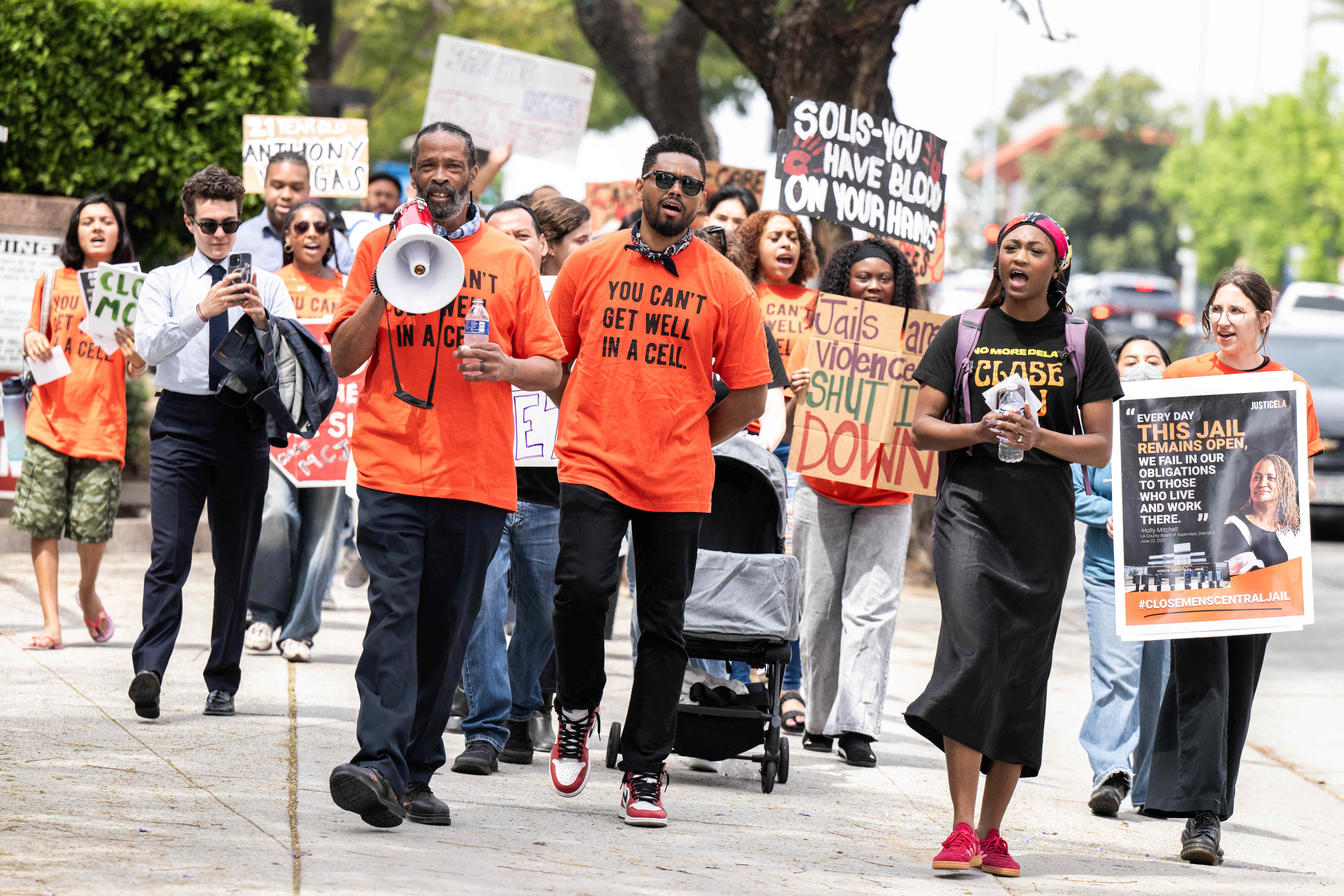 James Nelson, of Dignity and Power Now, leads a JusticeLA...