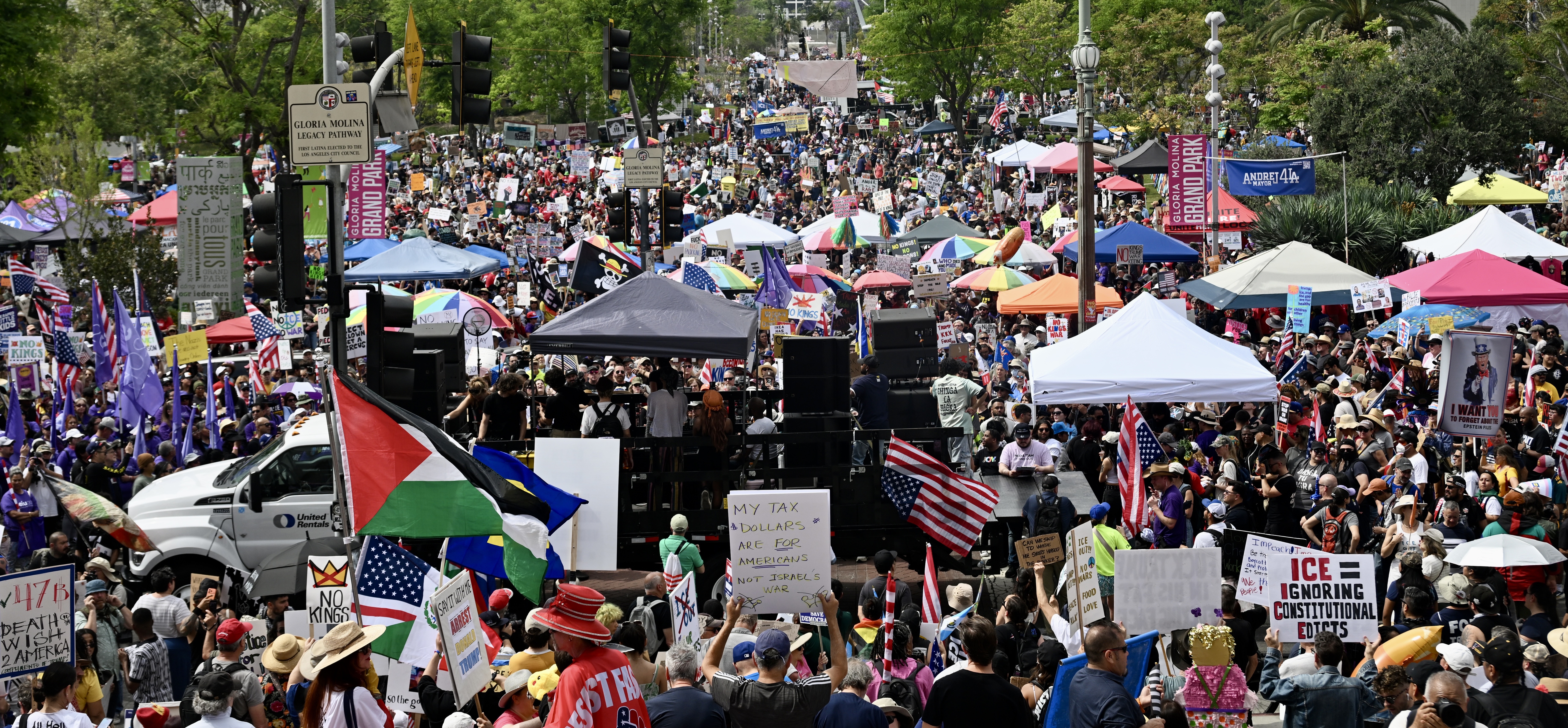 Throngs of people came come out, wearing costumes, holding signs,...