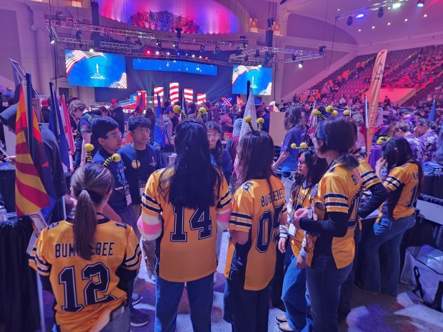 Team Bumble Bee, in matching yellow jerseys, socializes with another team at the U.S. Governors Cup Feb. 20-21 in Washington, D.C. (Erwin Taganas)