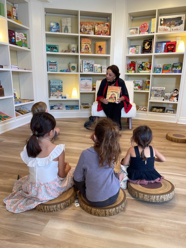 Author and La Jolla resident Zoe Ghahremani gives a reading to children at Bird Rock Bookshop on Oct. 25 as part of the BirdStock Music Festival. (Jodi Bratch)
