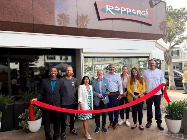 Members of the La Jolla Town Council and La Jolla Village Merchants Association join Roppongi General Manager Humberto Ramirez, team member Jo Mollenhauer, President and Chief Financial Officer Amy Bulgatz and executive chef Alfie Szeprethy at a March 25 ribbon-cutting to celebrate the restaurant's recent reopening. (Roppongi Restaurant & Lounge)