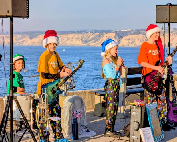 Elemental Sparks performs at the Children's Pool in La Jolla last year. Luca Giaconi, playing bass for the band, was named to San Diego Unified School District's middle school honors ensemble as a percussionist. (Jennifer Giaconi)