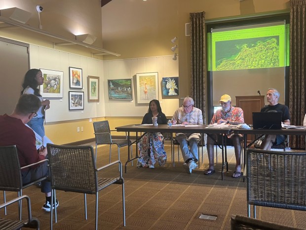 Jessica Hill (left), special-events manager for the Challenged Athletes Foundation, shares plans for this year's San Diego Triathlon Challenge with the La Jolla Traffic & Transportation Board at its March 17 meeting. (Noah Lyons)