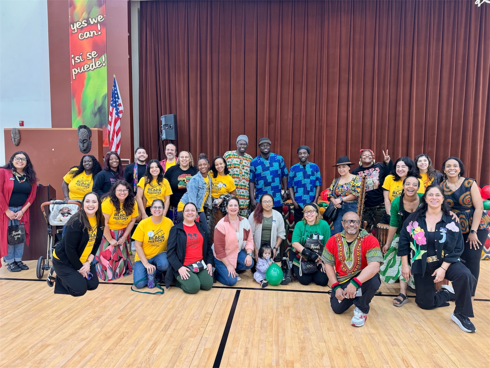 Ame Kora music group poses with school staff and members...