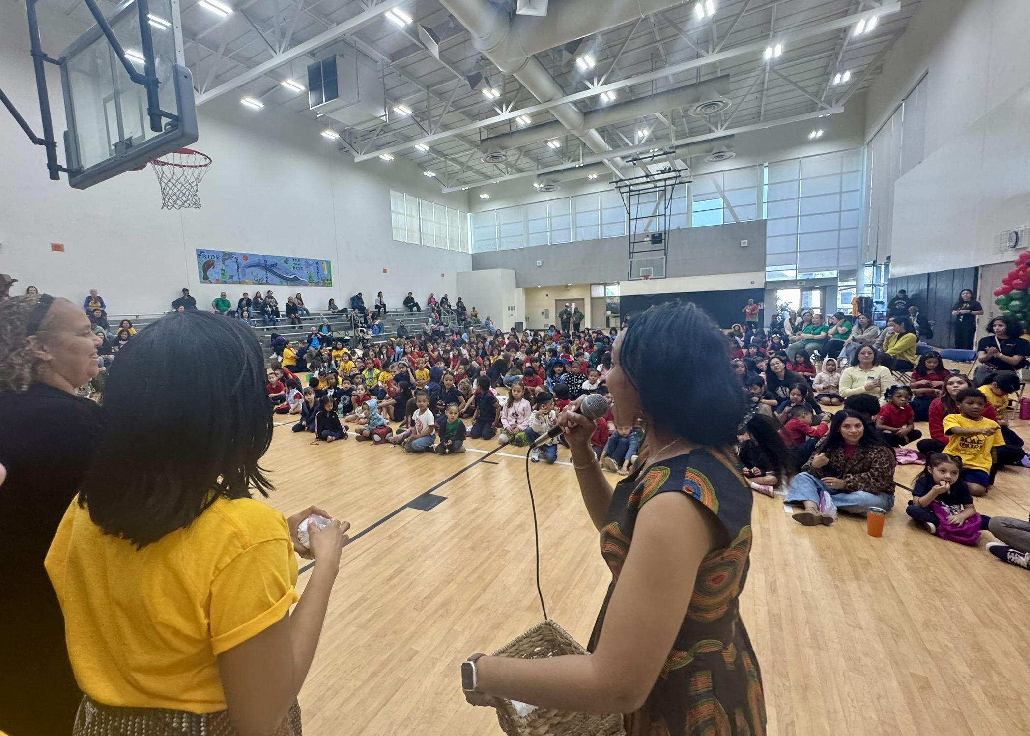 Students listen to Sankofa Parent Village speakers and West African...