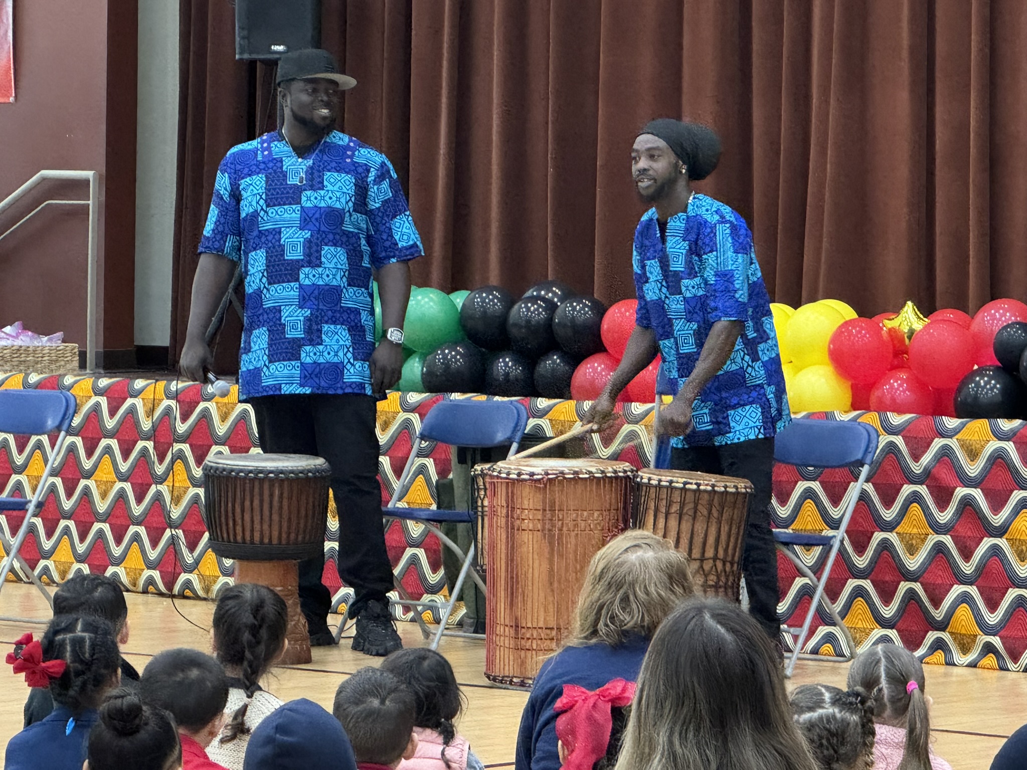 Musicians from the Ame Kora music group play the West...
