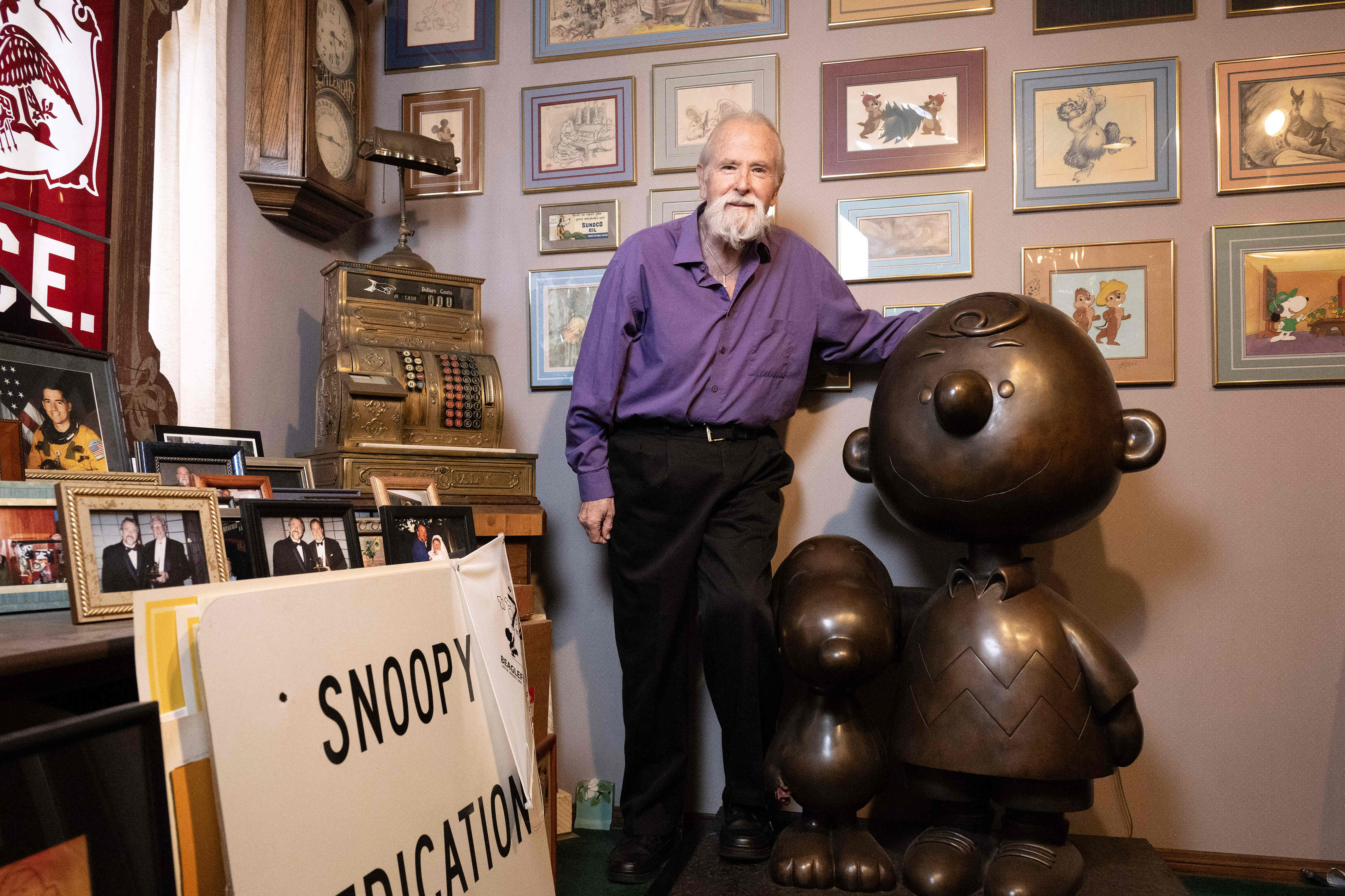 Stan Pawlowski poses for a photograph with his bronze sculpture...