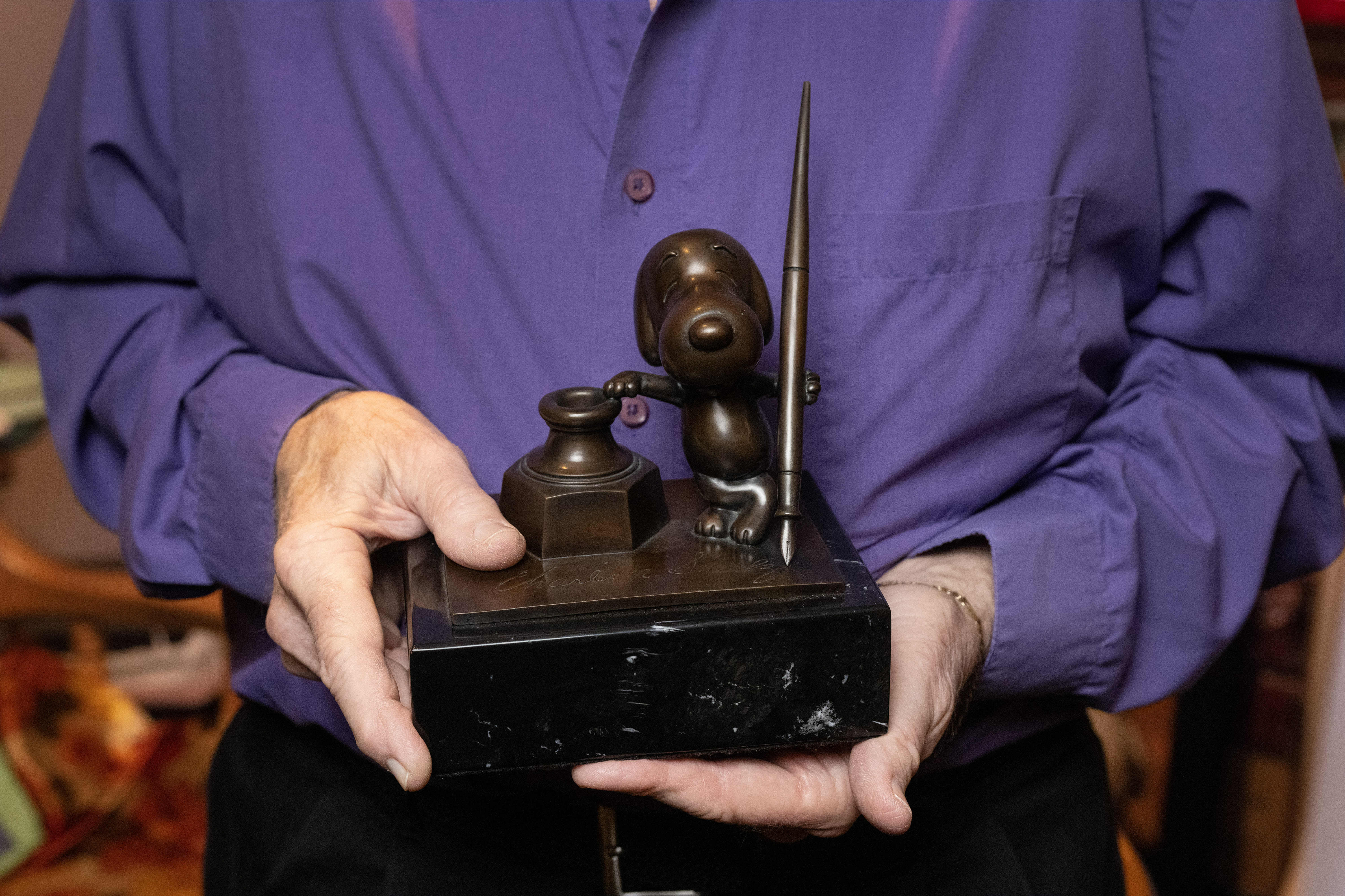 Stan Pawlowski poses for a photograph with the Cartoon Art...