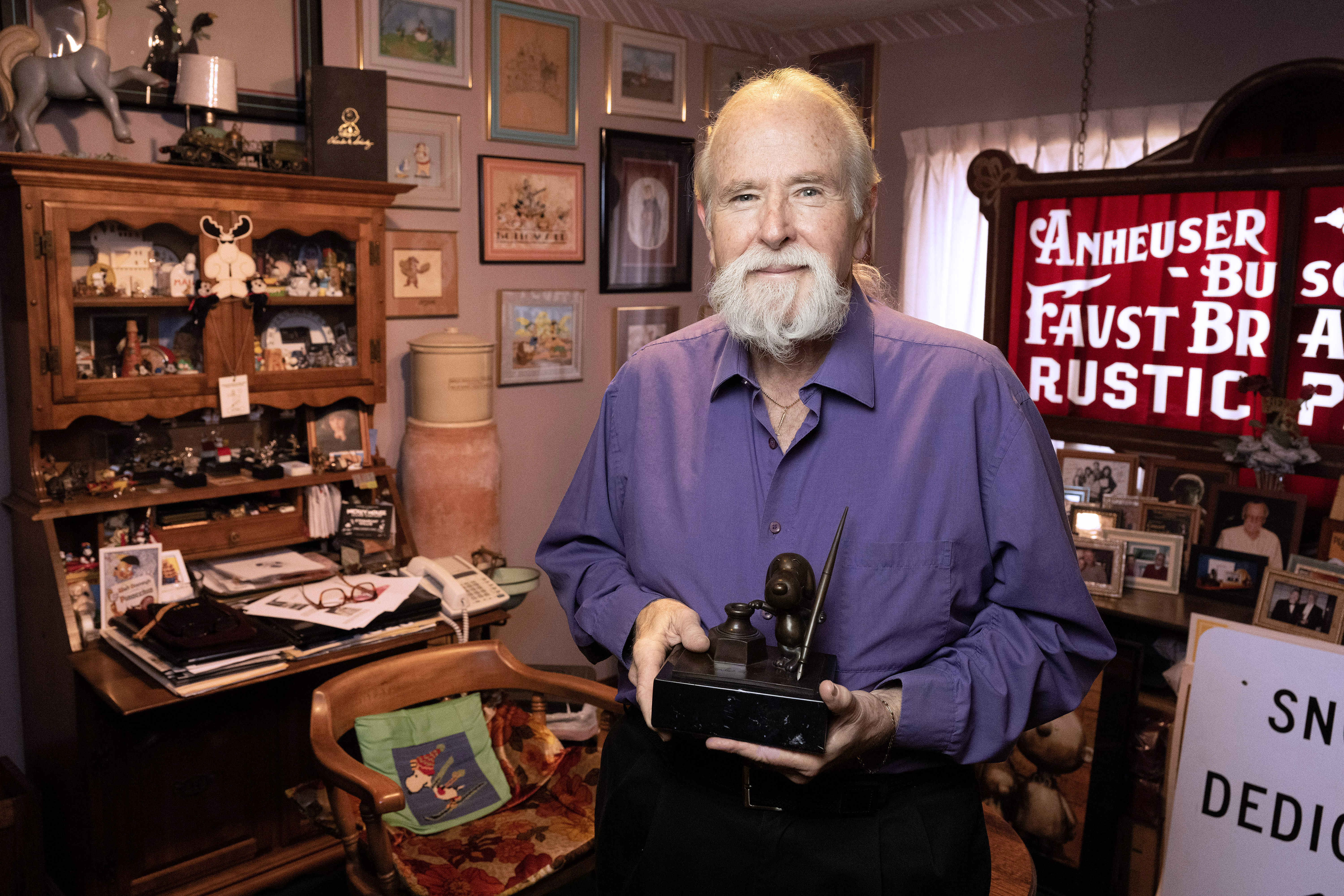 Stan Pawlowski poses for a photograph with the Cartoon Art...