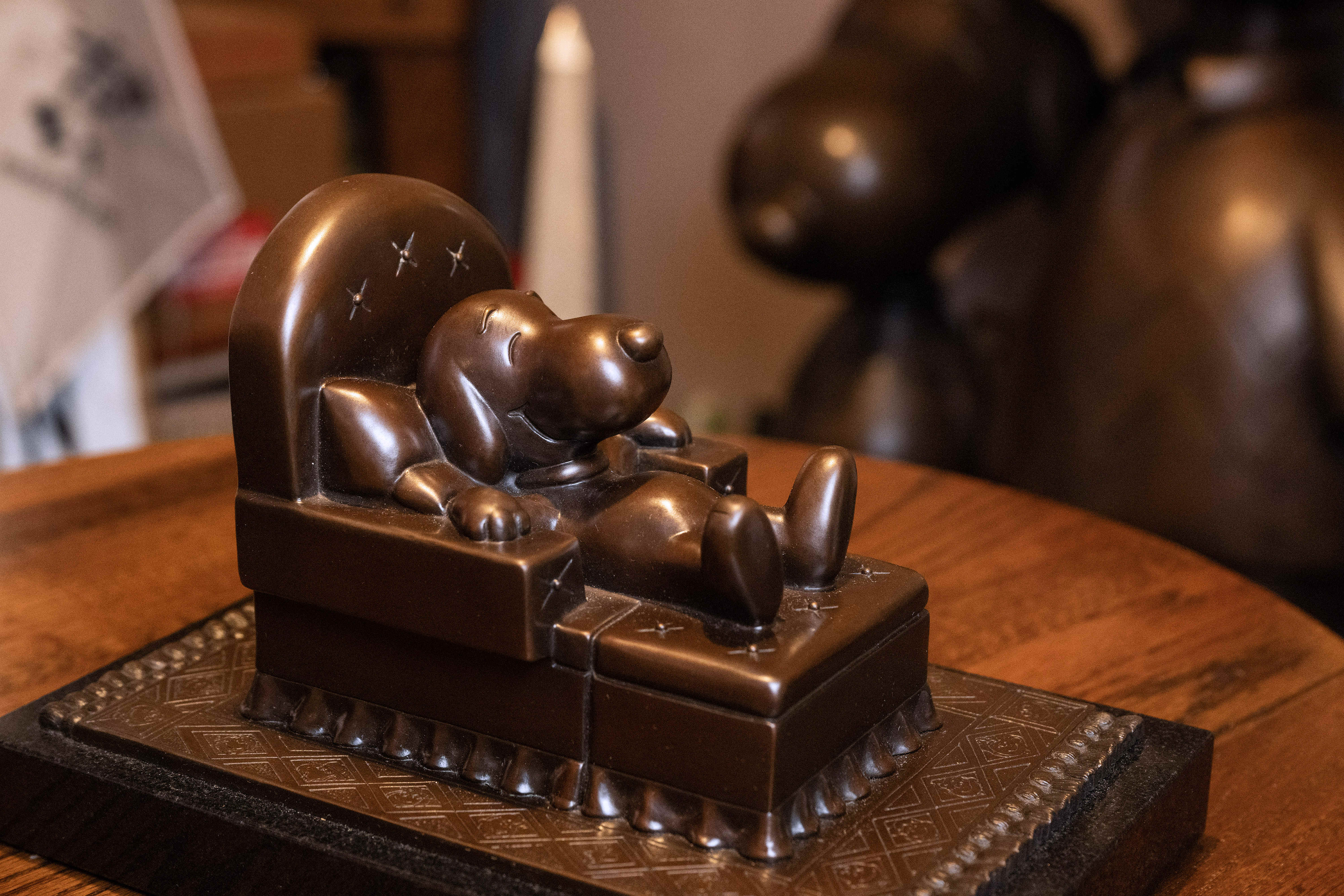 A bronze sculpture of Snoopy titled âRetired,â on display at...