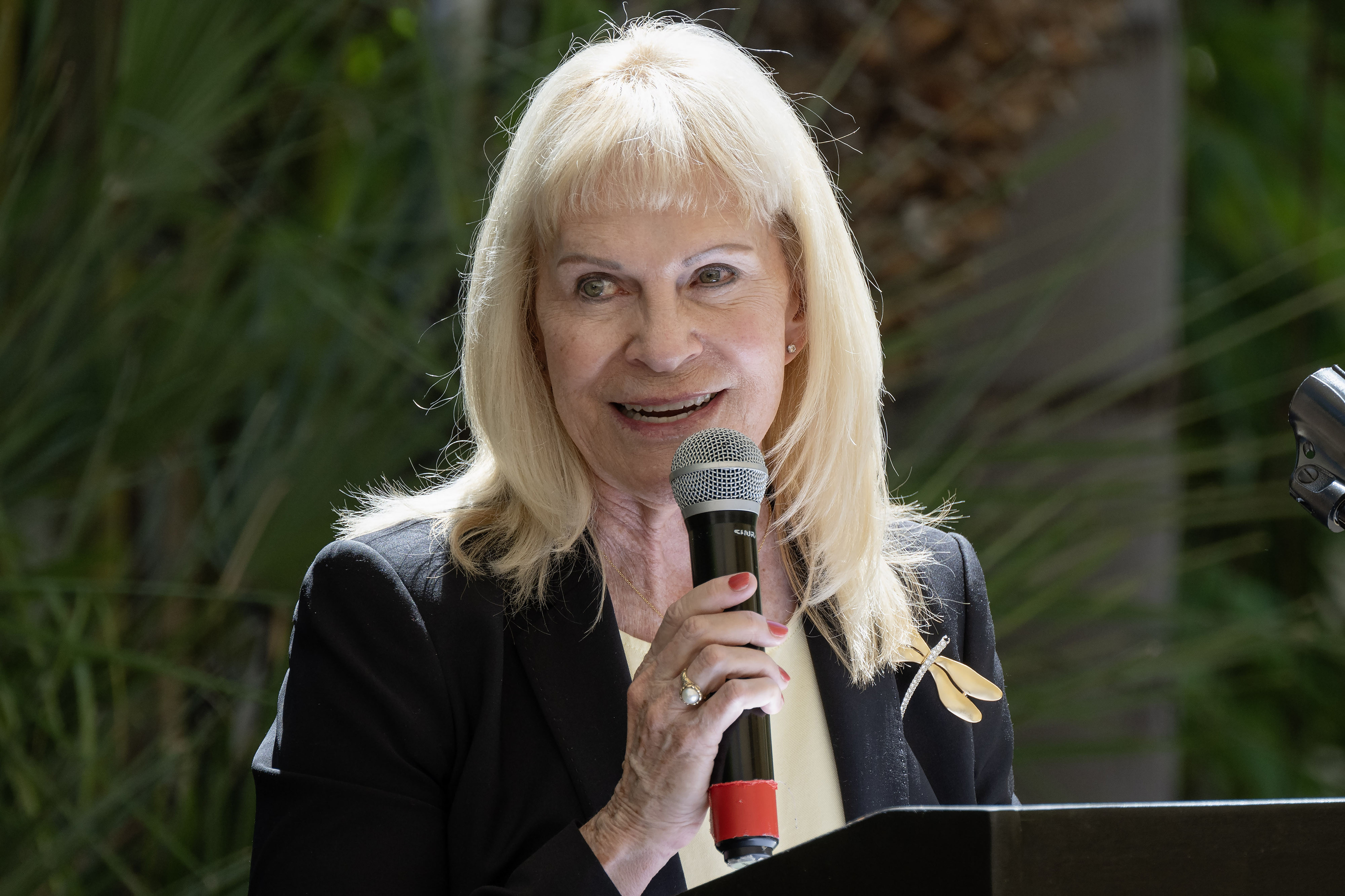 Gina Rushing Maguire speaks after being recognized by the Rick...