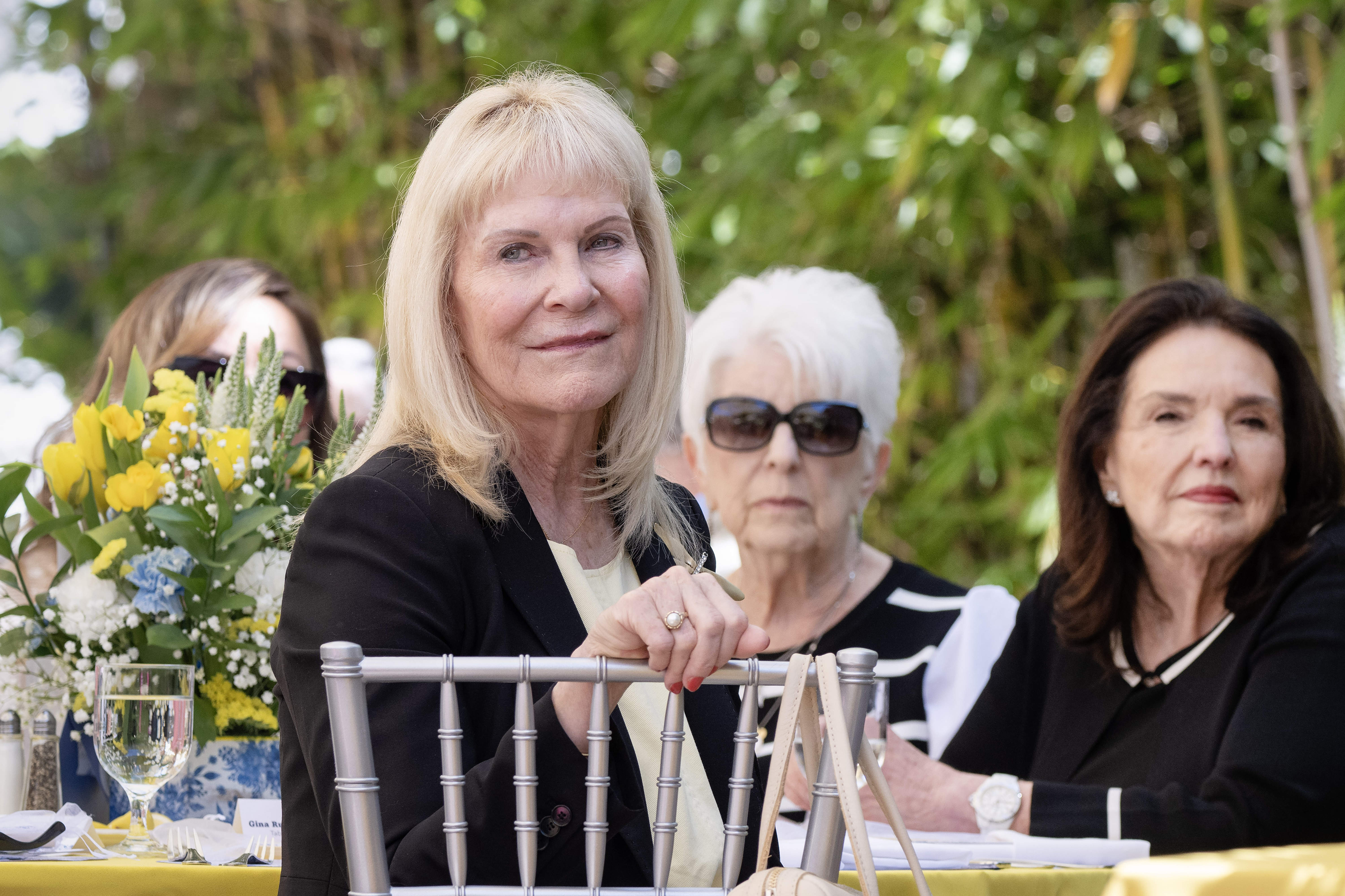 Gina Rushing Maguire is recognized by the Rick Rackers, an...