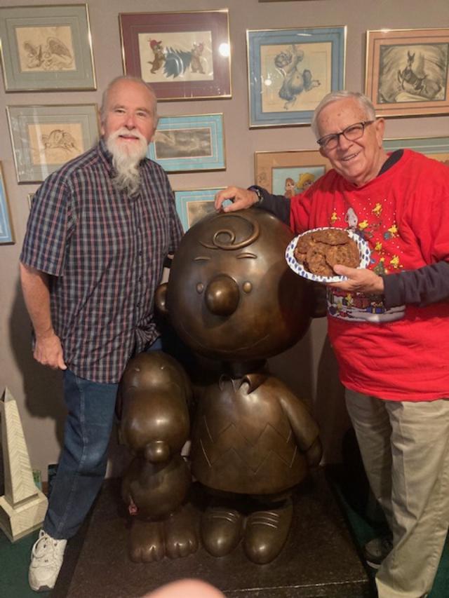 Stan Pawlowski with Rich Archbold holding a plate of the...