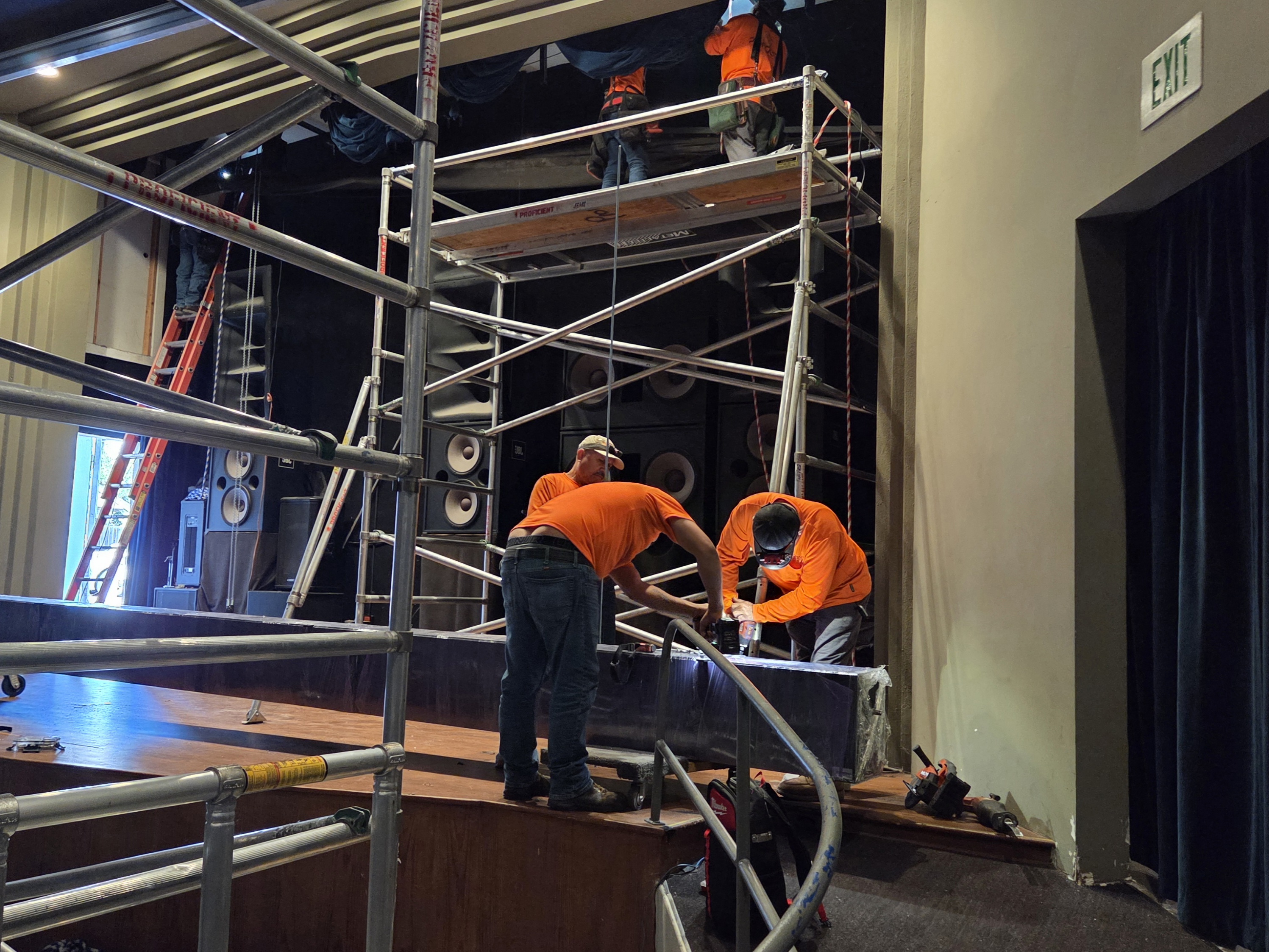 Workers install a new 4K projector at The Art Theatre...