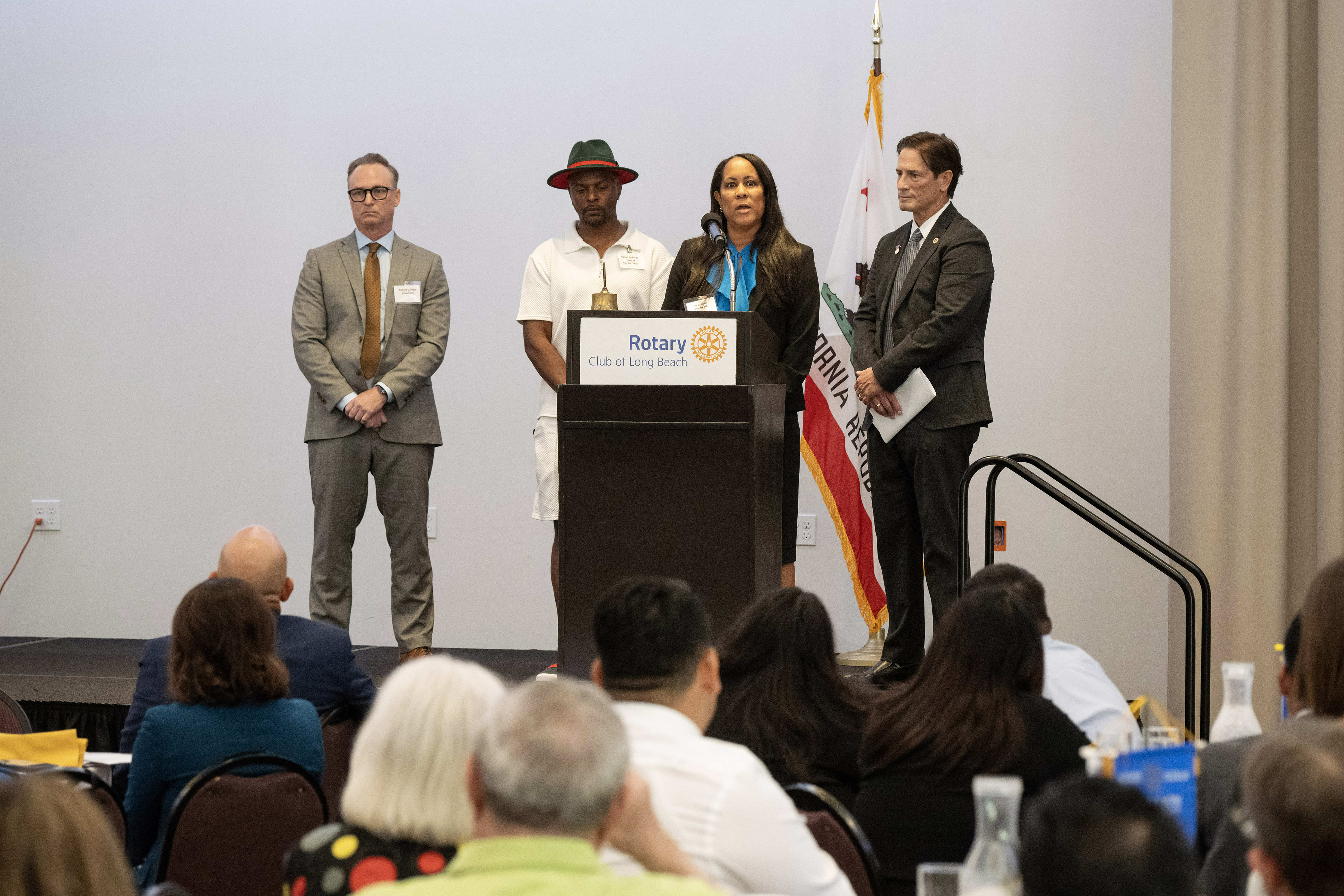 Deputy DA Joy Roberts speaks before presenting Daniel Edwards with...