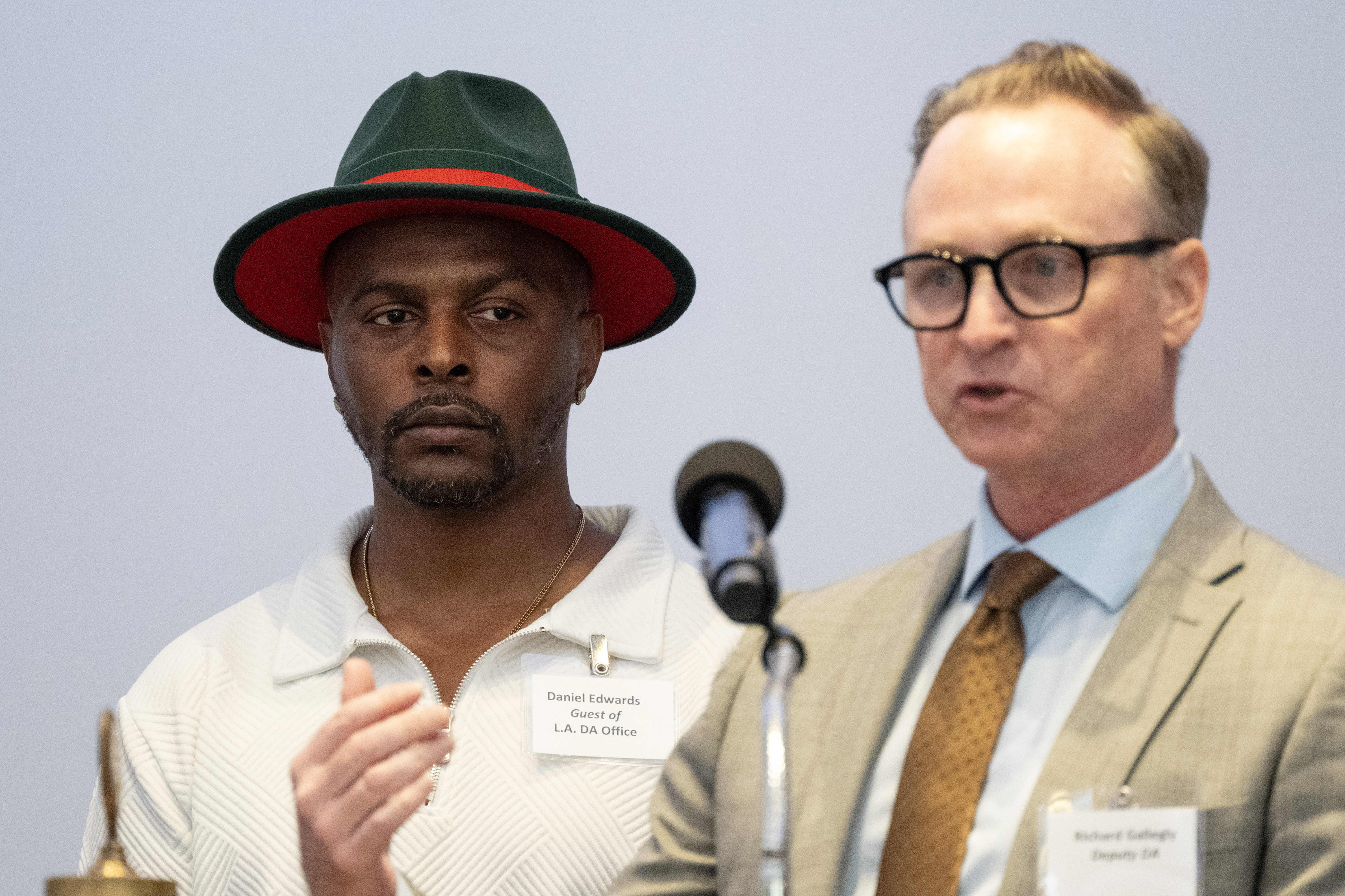 From right, Deputy DA Richard Gallegly speaks before presenting Daniel...