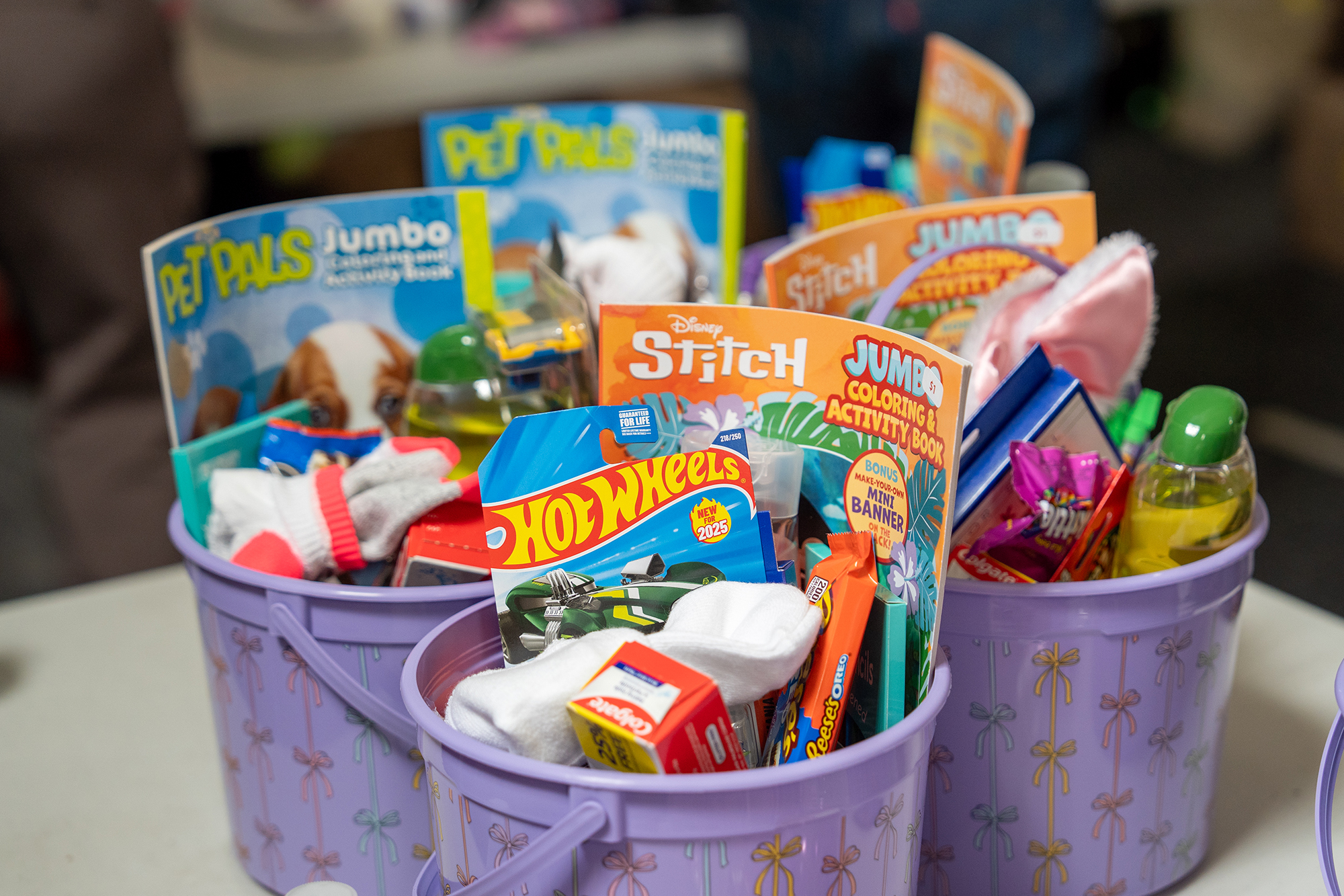 Gift baskets wait to be wrapped by volunteers during the...