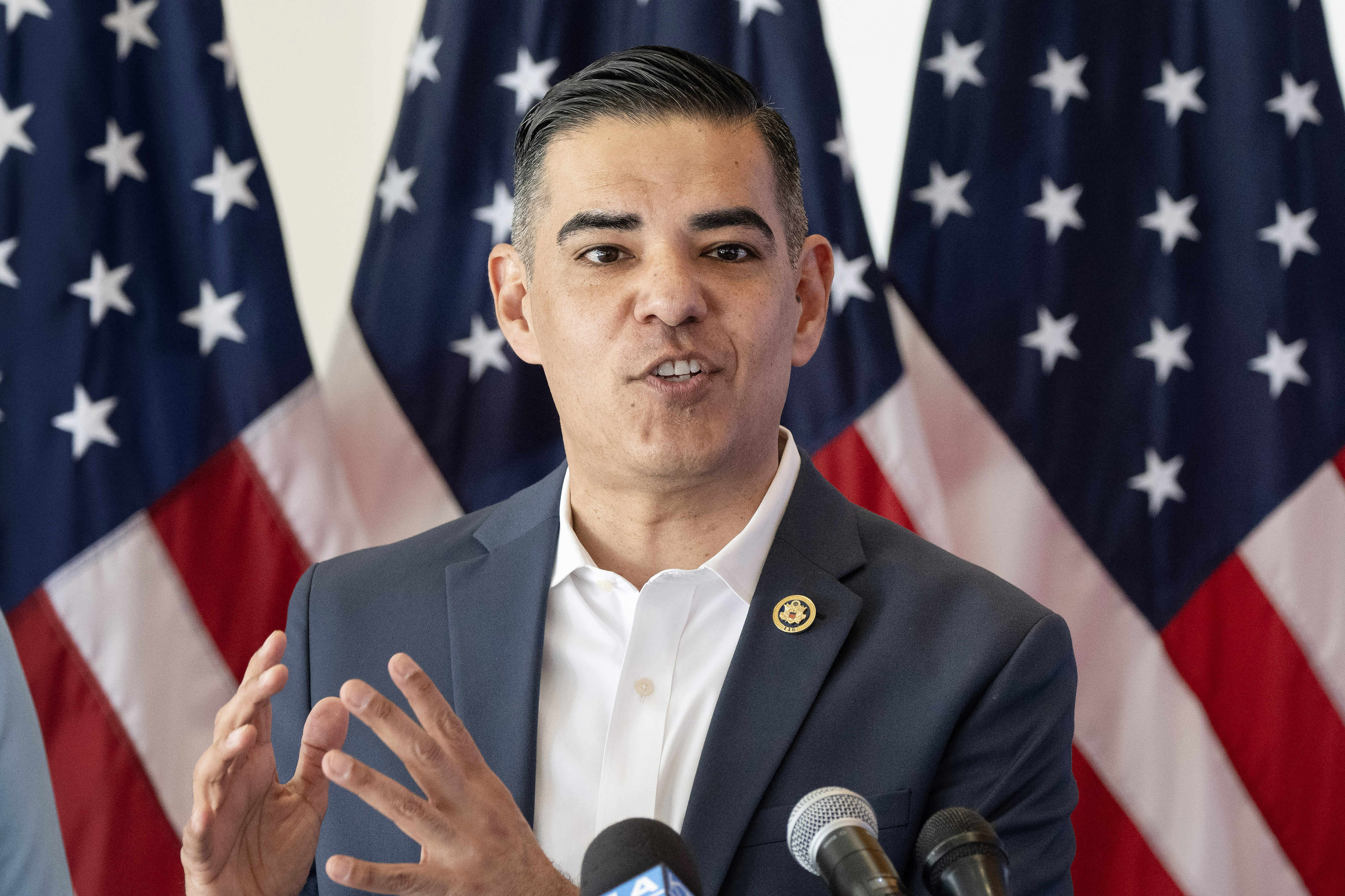 Rep. Robert Garcia speaks before presenting more than $2.9 million...