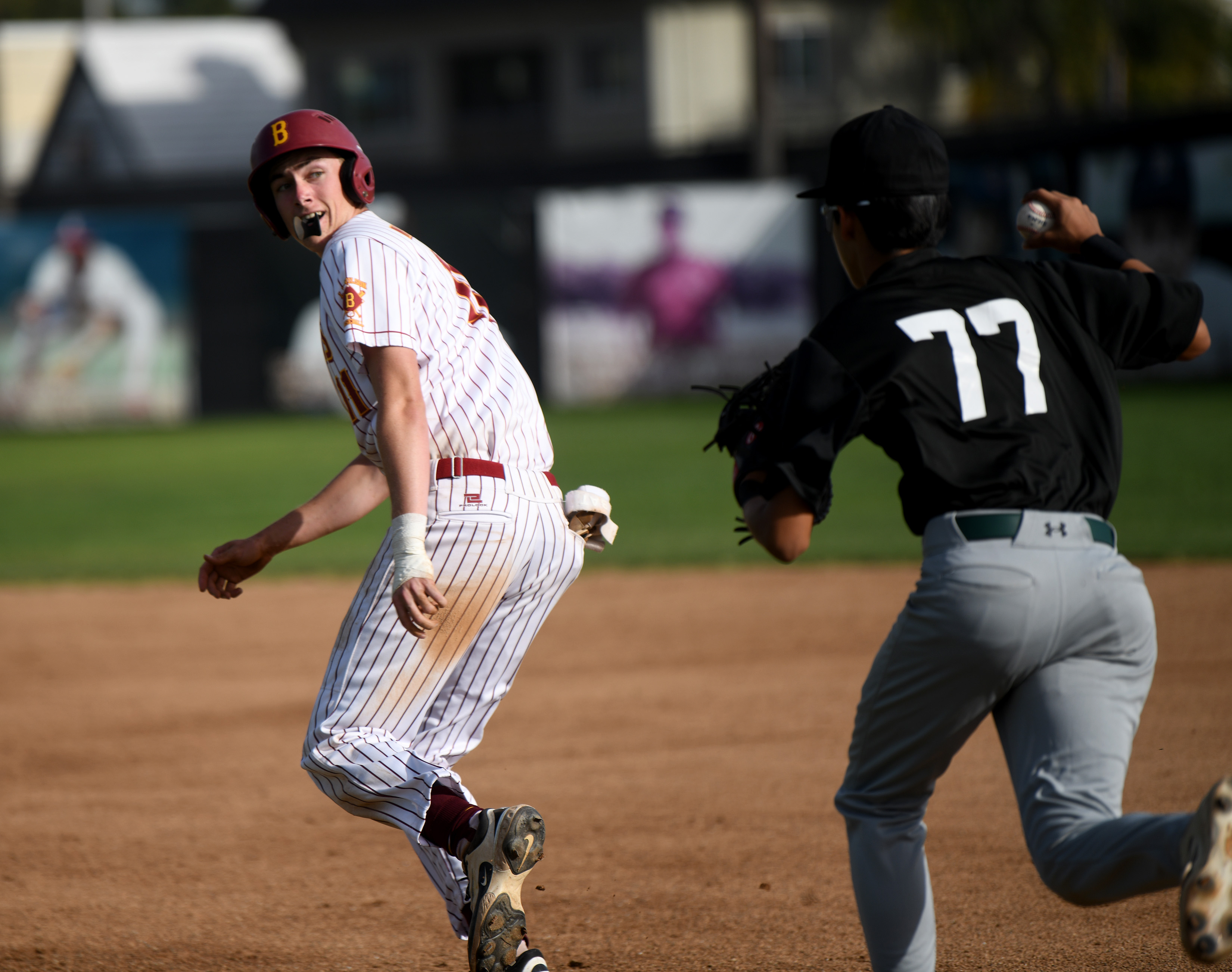 Wilson baserunner James Mirabile is chased by Cabrilloâs Daniel Jauregui...
