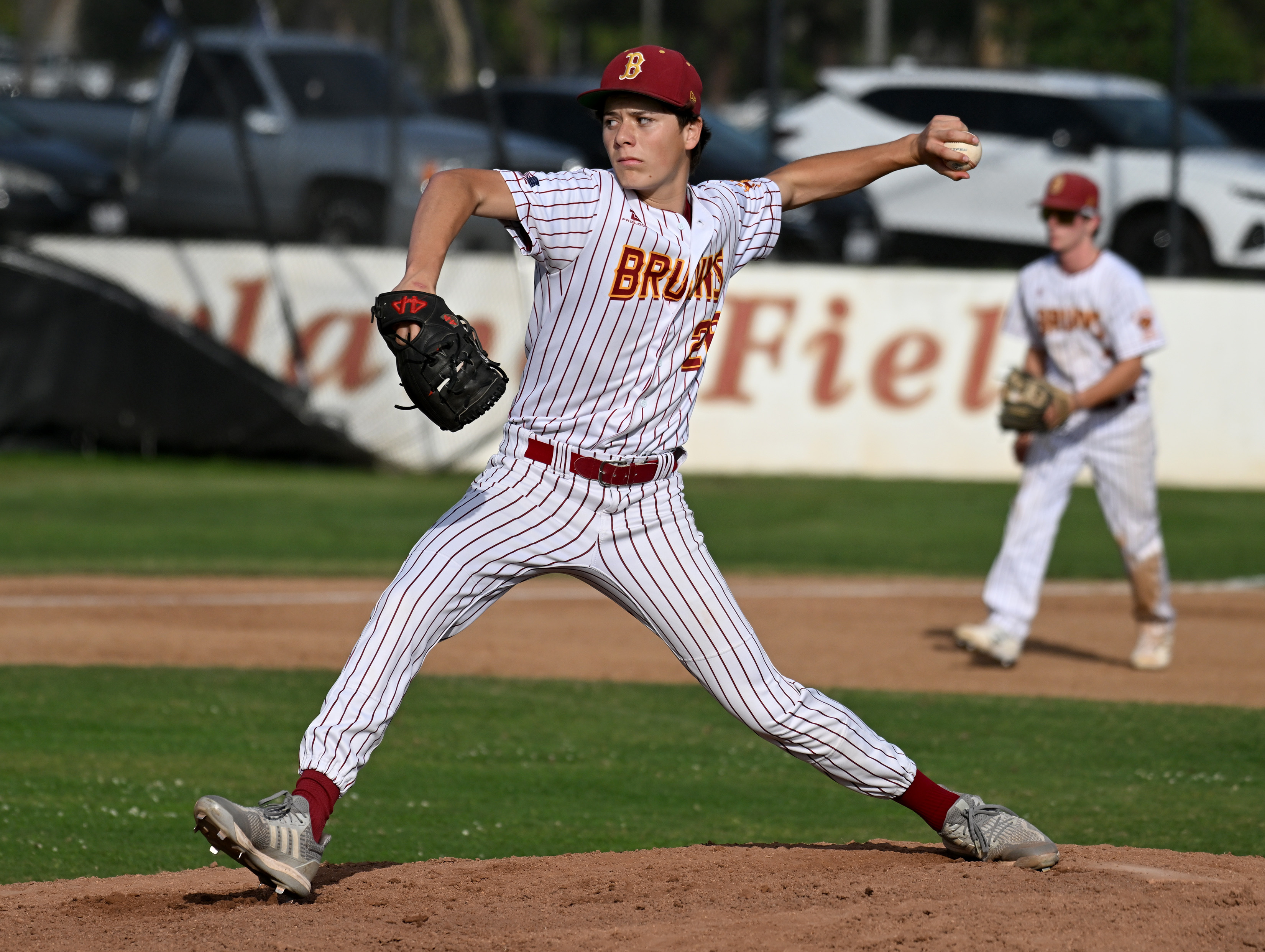 Agi Chandler pitches relief for Wilson against Cabrilllo during opening...