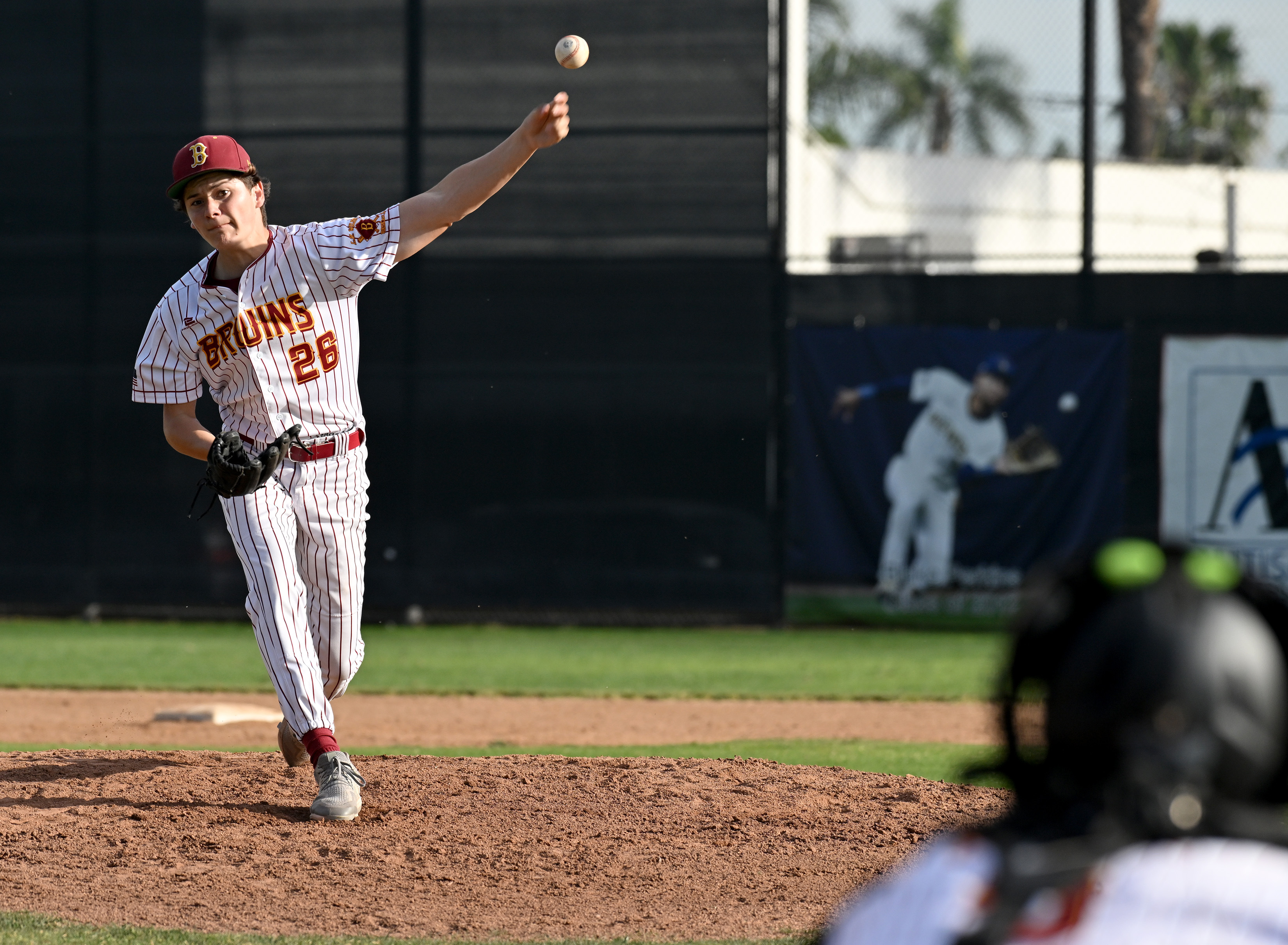 Agi Chandler pitches relief for Wilson against Cabrilllo during opening...