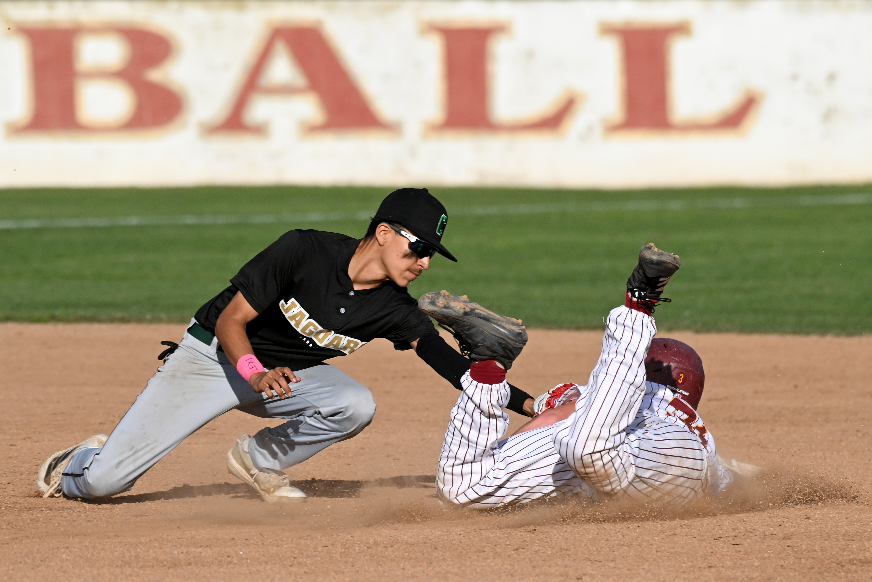 Wilson baserunner Gabe Opp is tagged out by Cabrillo second...